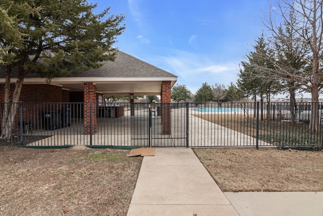 surrounding community with a swimming pool and a patio area