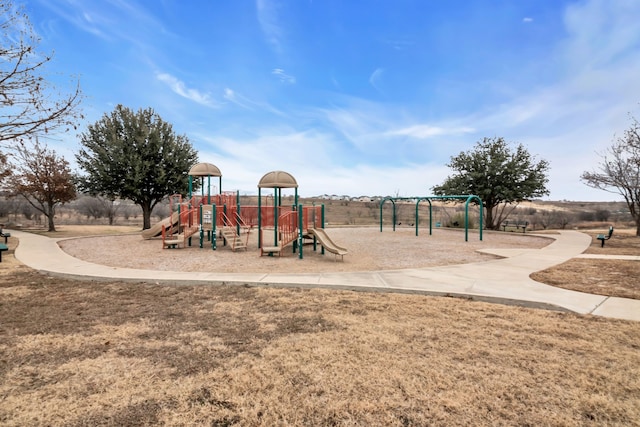 view of playground with a lawn