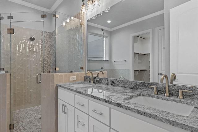 bathroom featuring crown molding, an enclosed shower, and vanity