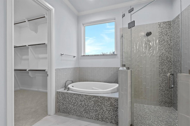 bathroom featuring independent shower and bath and ornamental molding