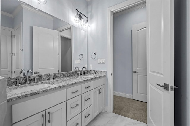 bathroom with vanity and ornamental molding