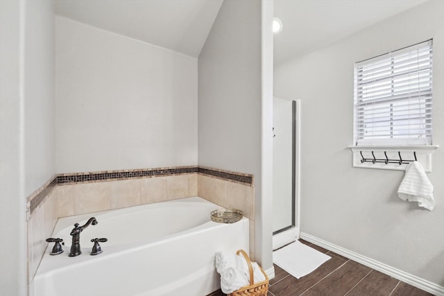 bathroom with plus walk in shower and lofted ceiling