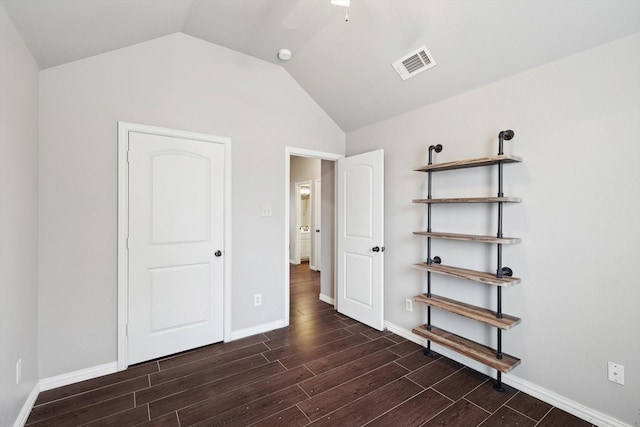 unfurnished bedroom with vaulted ceiling and ceiling fan