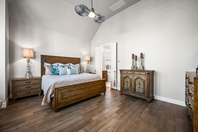 bedroom featuring high vaulted ceiling and dark wood-type flooring