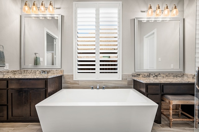 bathroom with a bathtub and vanity