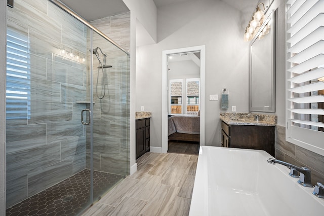 bathroom with an enclosed shower and vanity