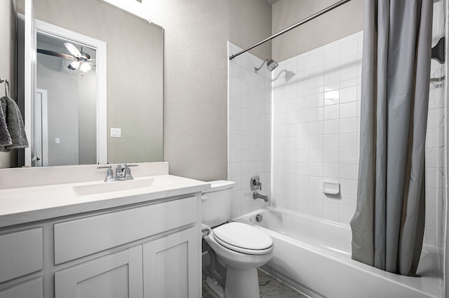 full bathroom featuring ceiling fan, toilet, vanity, and shower / tub combo with curtain