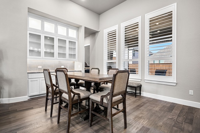 dining area with dark wood-type flooring