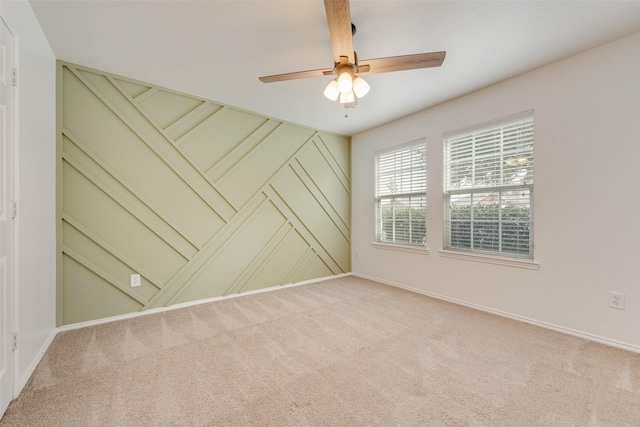 carpeted empty room with ceiling fan