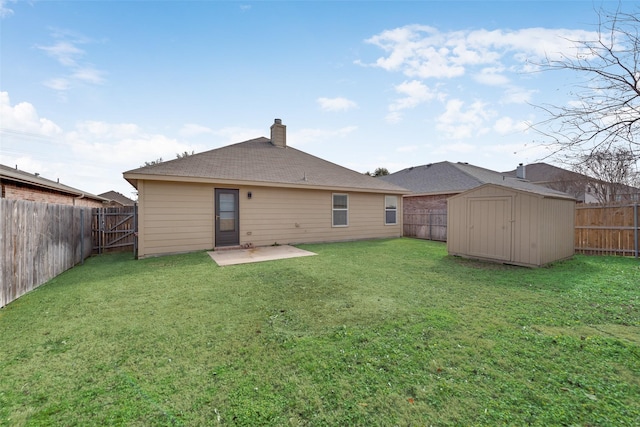 rear view of property with a patio area, a lawn, and a shed