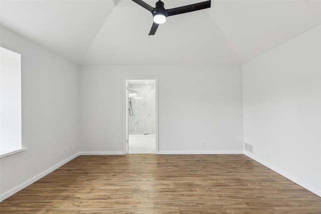 interior space with ceiling fan, hardwood / wood-style floors, and lofted ceiling