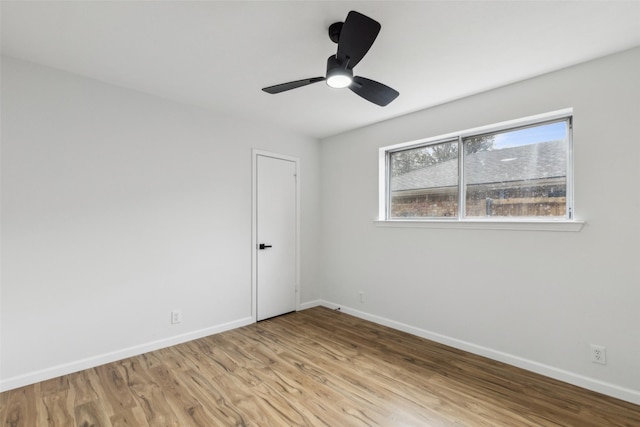 unfurnished room featuring light hardwood / wood-style flooring and ceiling fan