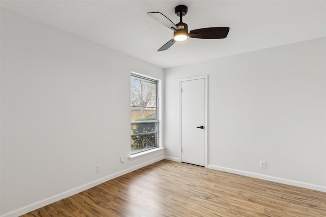 empty room featuring light hardwood / wood-style flooring and ceiling fan