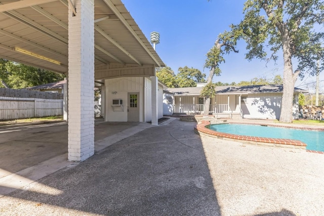 view of swimming pool with a patio