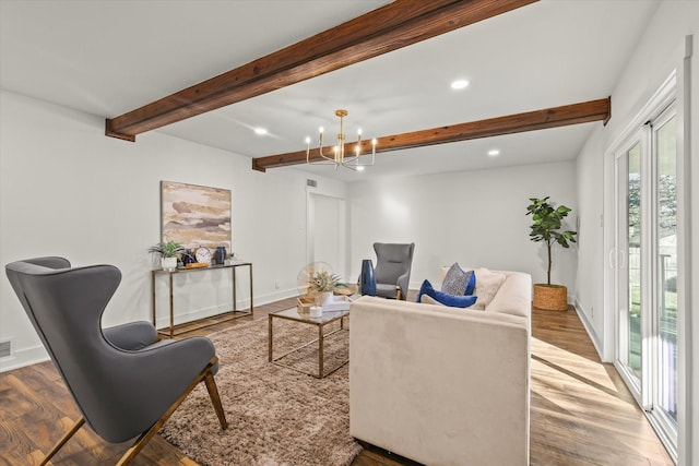 living room featuring wood-type flooring, beam ceiling, and a notable chandelier