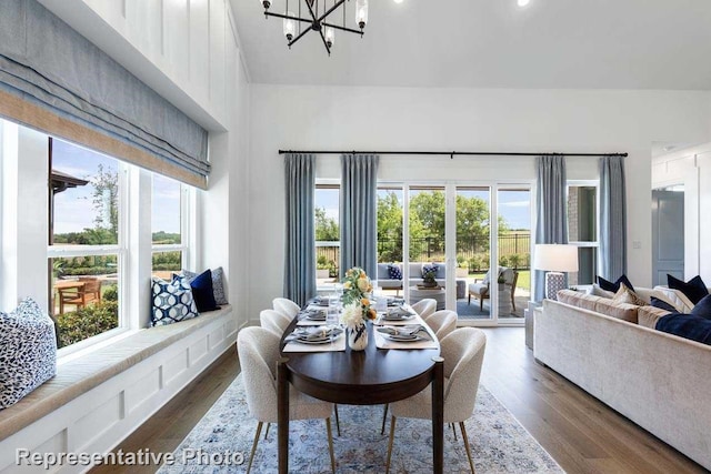 dining space featuring a chandelier and dark hardwood / wood-style floors