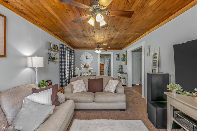 carpeted living room with ornamental molding, ceiling fan, and wood ceiling