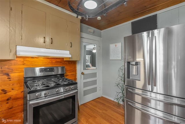 kitchen with light hardwood / wood-style floors and appliances with stainless steel finishes