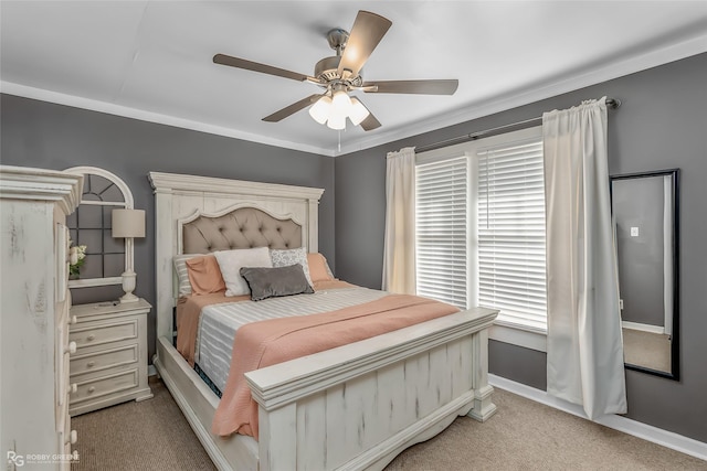 bedroom with crown molding, light colored carpet, and ceiling fan