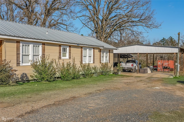 view of home's exterior with a carport