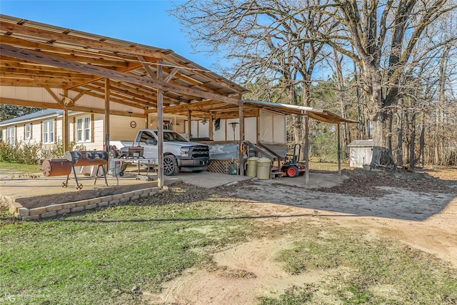 exterior space with a carport