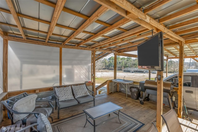 wooden deck with an outdoor living space