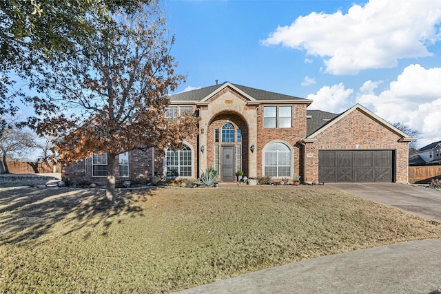 front of property with a garage and a front yard