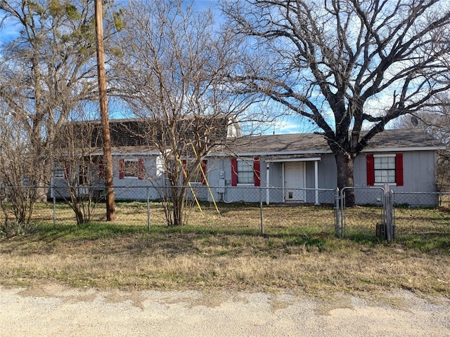 ranch-style house with a fenced front yard