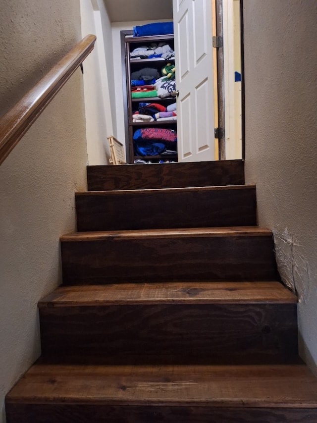 stairs with a textured wall