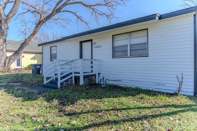 ranch-style home with a front lawn