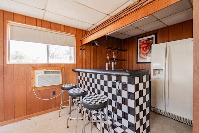 rec room featuring wood walls, light colored carpet, a drop ceiling, and billiards