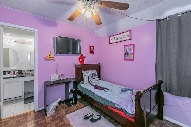 bedroom featuring lofted ceiling, dark parquet floors, a textured ceiling, and ceiling fan