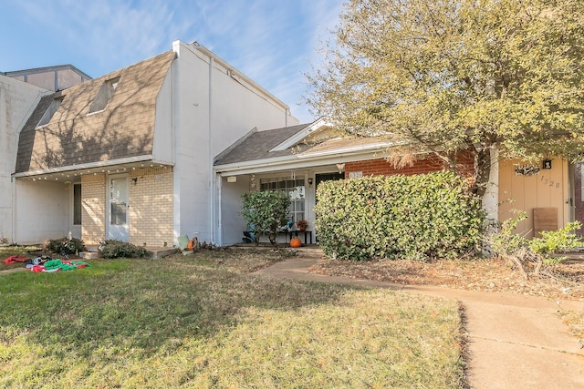 view of front of home with a front yard