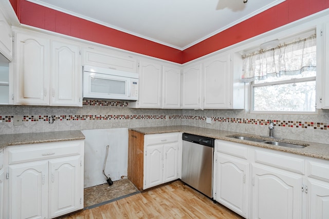 kitchen featuring dishwasher, white cabinetry, sink, ornamental molding, and light wood-type flooring