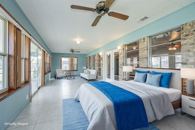 bedroom with ceiling fan, access to exterior, french doors, and light tile patterned flooring