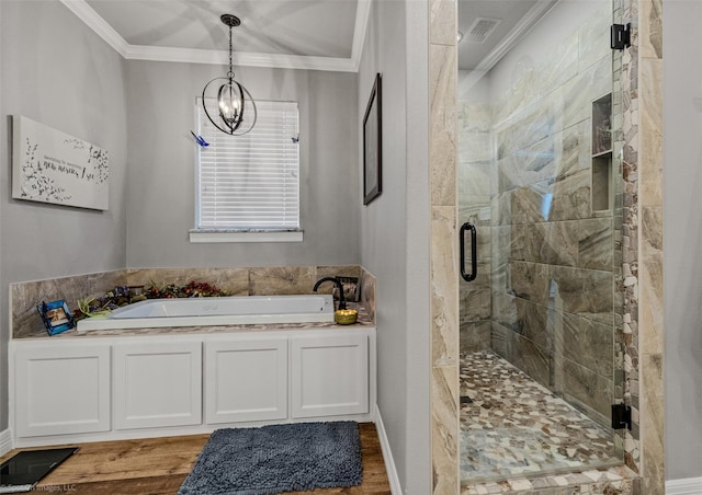 bathroom with a chandelier, shower with separate bathtub, ornamental molding, and wood-type flooring