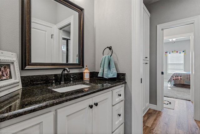 bathroom with vanity and hardwood / wood-style flooring