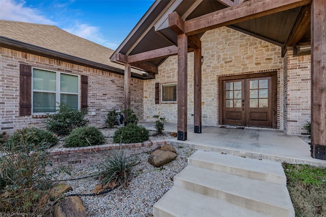 view of exterior entry featuring french doors