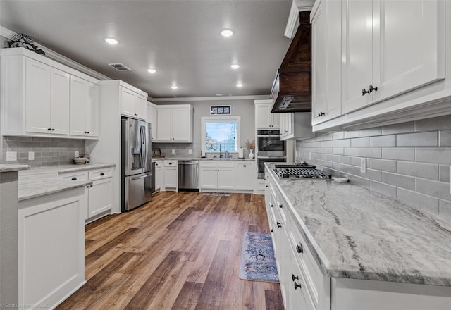 kitchen with sink, white cabinetry, and appliances with stainless steel finishes