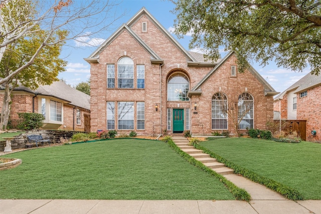 view of front of property with brick siding and a front lawn