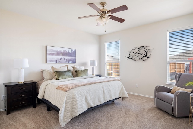 bedroom featuring light colored carpet and ceiling fan