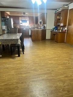 dining area with hardwood / wood-style flooring and ceiling fan