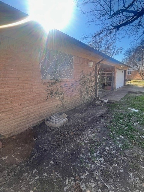 view of side of property featuring a garage