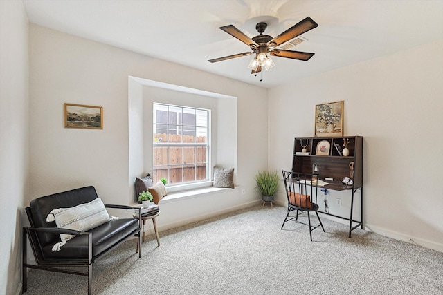 sitting room featuring carpet, visible vents, ceiling fan, and baseboards