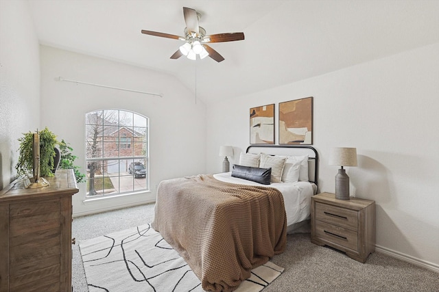 bedroom with a ceiling fan, lofted ceiling, light carpet, and baseboards