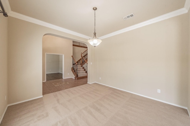 unfurnished room featuring crown molding and carpet flooring