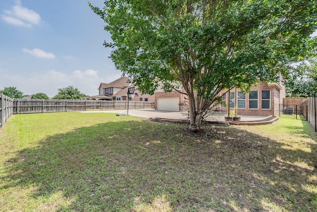 view of yard featuring a garage