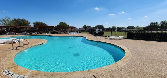 view of pool featuring a patio