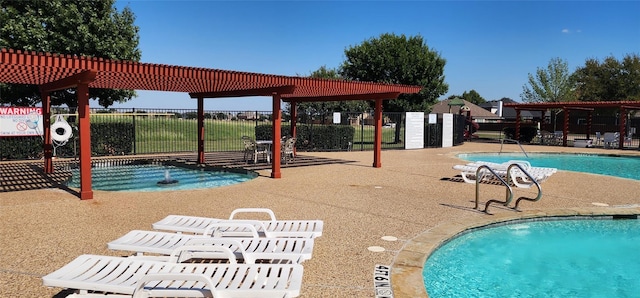 view of swimming pool with a pergola