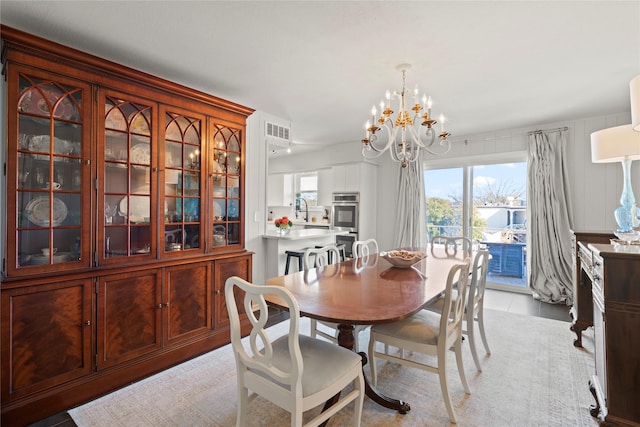 dining room with a notable chandelier